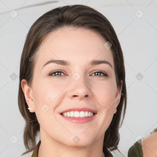 Joyful white young-adult female with medium  brown hair and grey eyes