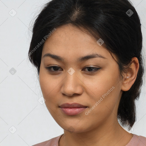 Joyful latino young-adult female with medium  brown hair and brown eyes