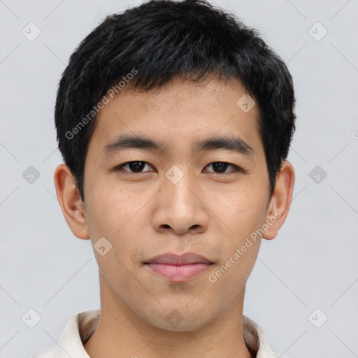Joyful asian young-adult male with short  black hair and brown eyes