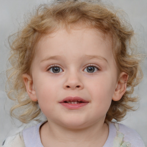 Joyful white child female with medium  brown hair and blue eyes