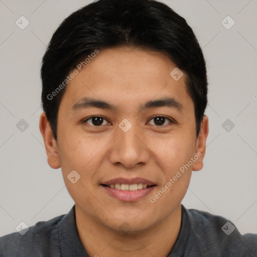 Joyful asian young-adult male with short  black hair and brown eyes