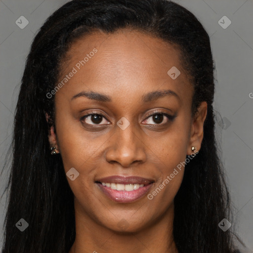 Joyful black young-adult female with long  brown hair and brown eyes