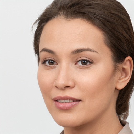 Joyful white young-adult female with medium  brown hair and brown eyes