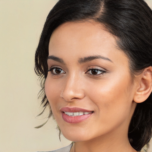 Joyful white young-adult female with medium  black hair and brown eyes