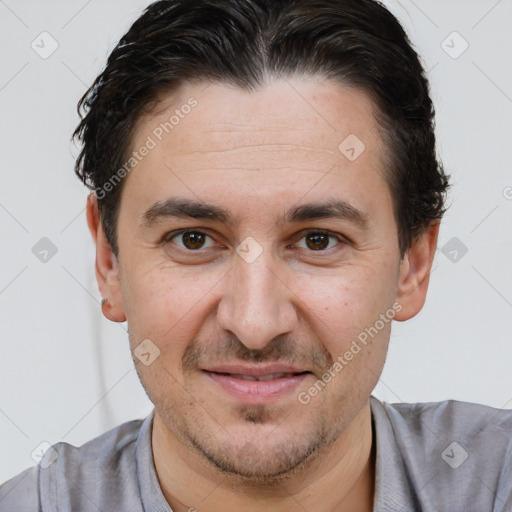 Joyful white adult male with short  brown hair and brown eyes