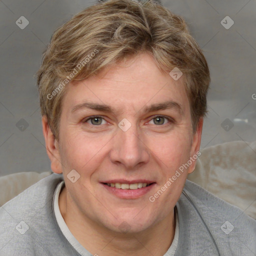 Joyful white adult female with short  brown hair and grey eyes