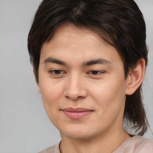 Joyful white young-adult male with medium  brown hair and brown eyes