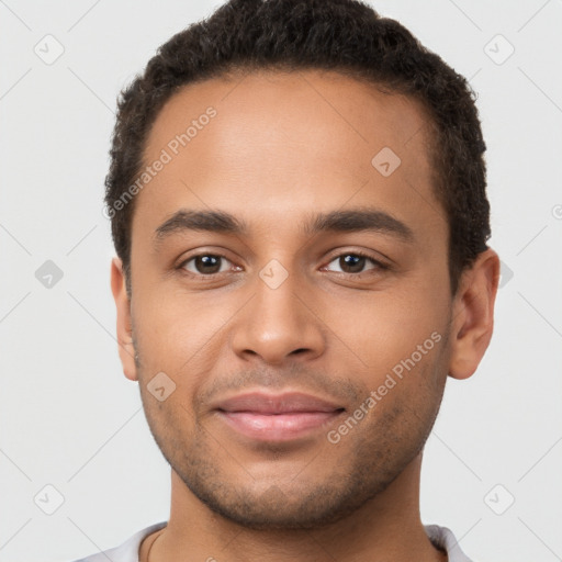 Joyful latino young-adult male with short  brown hair and brown eyes