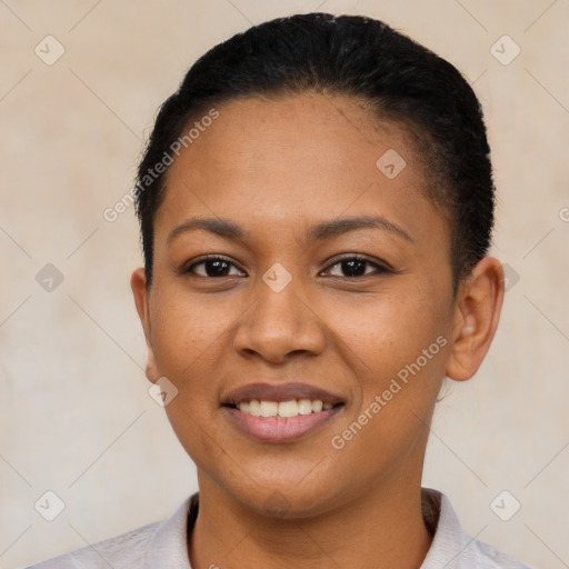 Joyful latino young-adult female with short  black hair and brown eyes