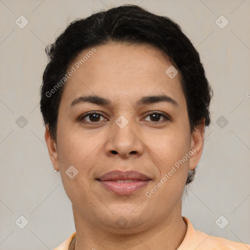 Joyful latino adult female with short  brown hair and brown eyes