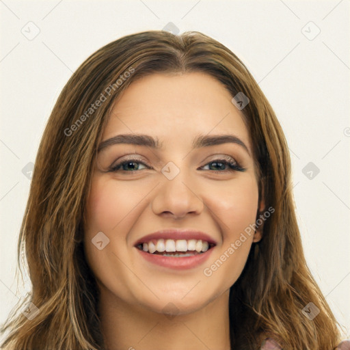 Joyful white young-adult female with long  brown hair and green eyes