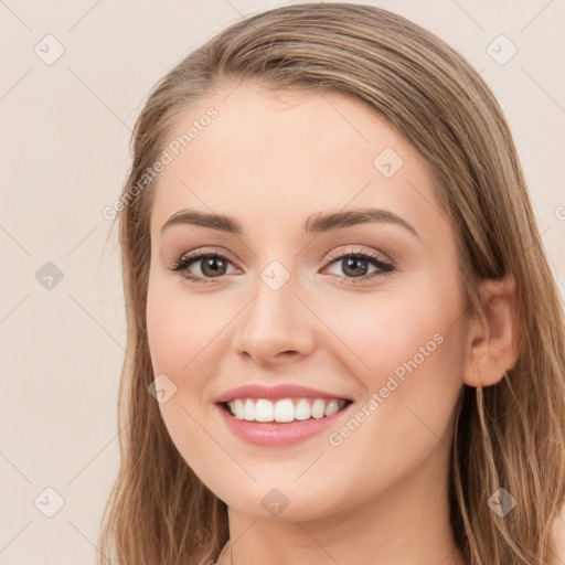 Joyful white young-adult female with long  brown hair and green eyes