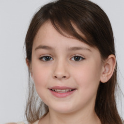 Joyful white child female with medium  brown hair and brown eyes