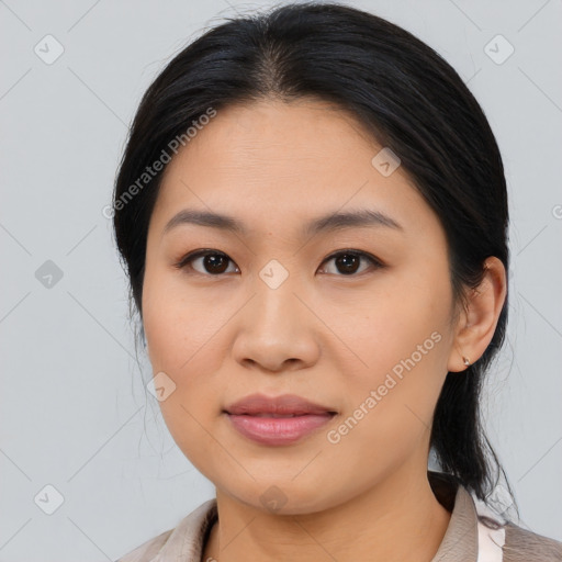 Joyful asian young-adult female with medium  brown hair and brown eyes