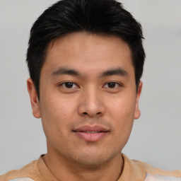 Neutral asian young-adult male with short  brown hair and brown eyes