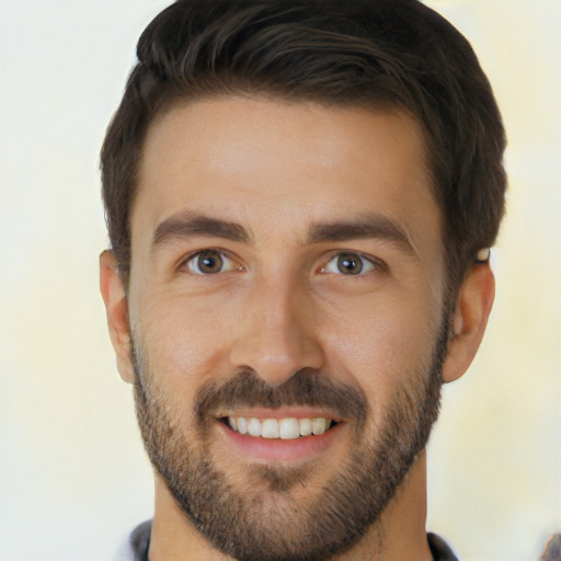 Joyful white young-adult male with short  brown hair and brown eyes