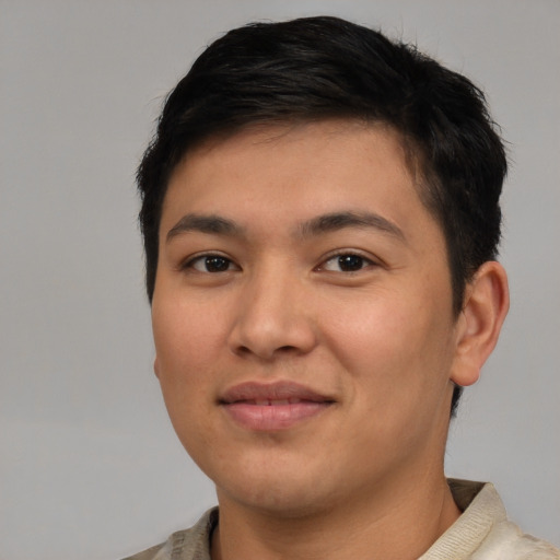 Joyful latino young-adult male with short  brown hair and brown eyes