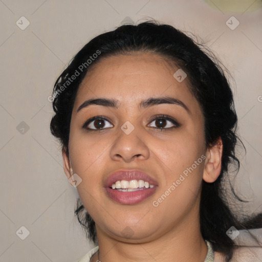 Joyful latino young-adult female with medium  black hair and brown eyes