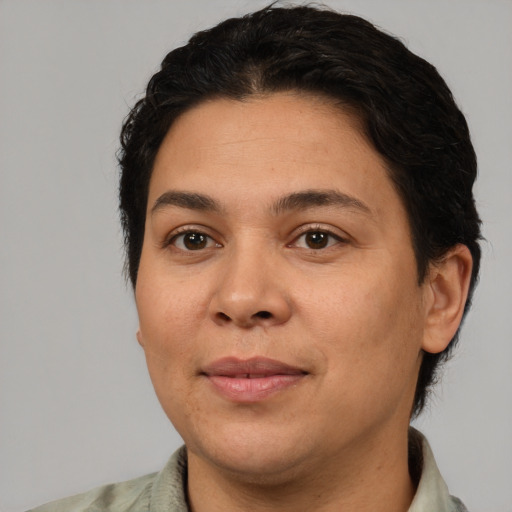 Joyful white young-adult female with short  black hair and brown eyes