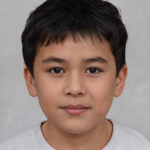 Joyful white child male with short  brown hair and brown eyes