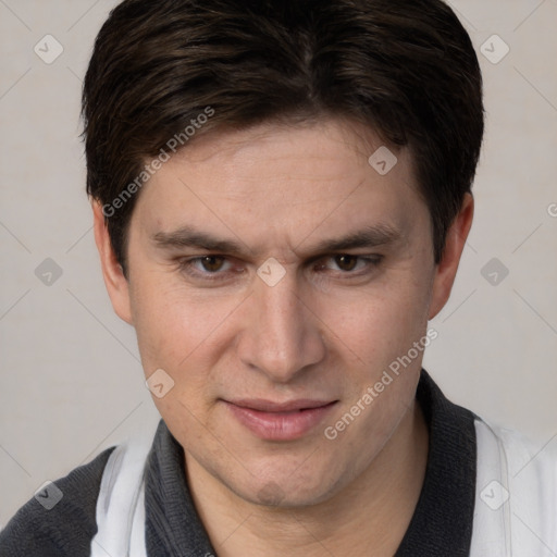 Joyful white adult male with short  brown hair and brown eyes