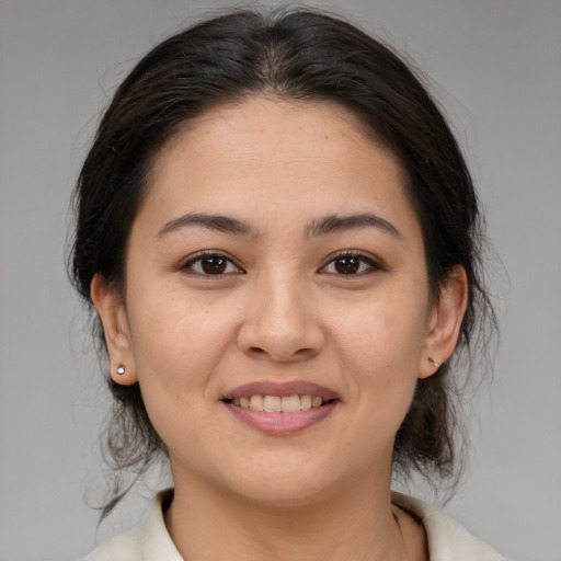 Joyful white young-adult female with medium  brown hair and brown eyes