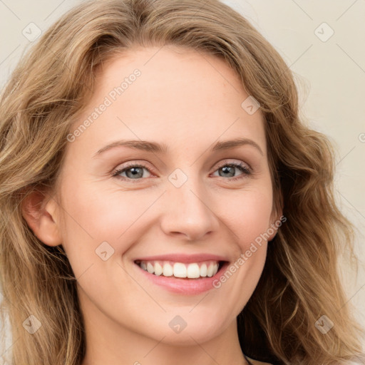 Joyful white young-adult female with long  brown hair and green eyes