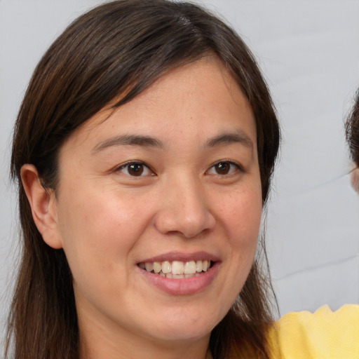 Joyful white young-adult female with medium  brown hair and brown eyes