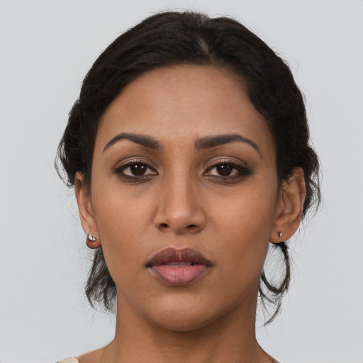 Neutral latino young-adult female with long  black hair and brown eyes