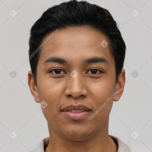 Joyful latino young-adult male with short  black hair and brown eyes