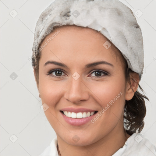 Joyful white young-adult female with medium  brown hair and brown eyes