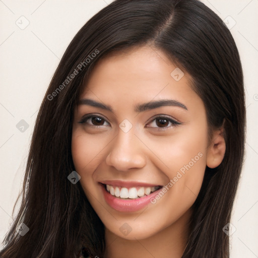 Joyful latino young-adult female with long  brown hair and brown eyes