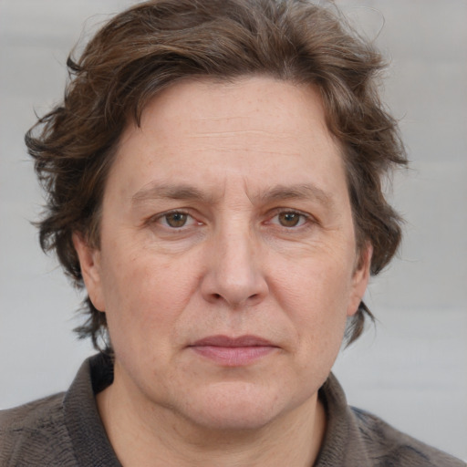 Joyful white adult male with medium  brown hair and grey eyes