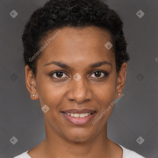 Joyful black young-adult female with short  black hair and brown eyes