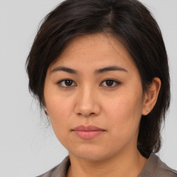 Neutral asian young-adult female with medium  brown hair and brown eyes