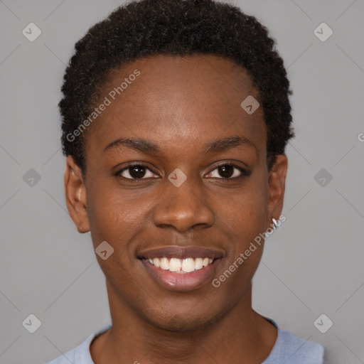 Joyful black young-adult female with short  black hair and brown eyes