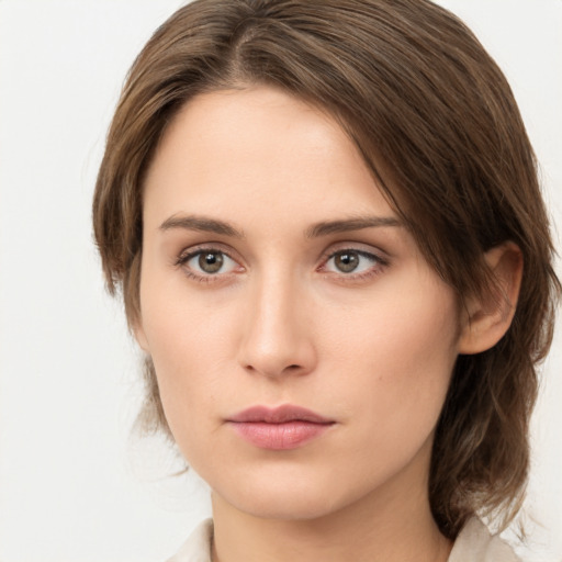 Neutral white young-adult female with medium  brown hair and green eyes