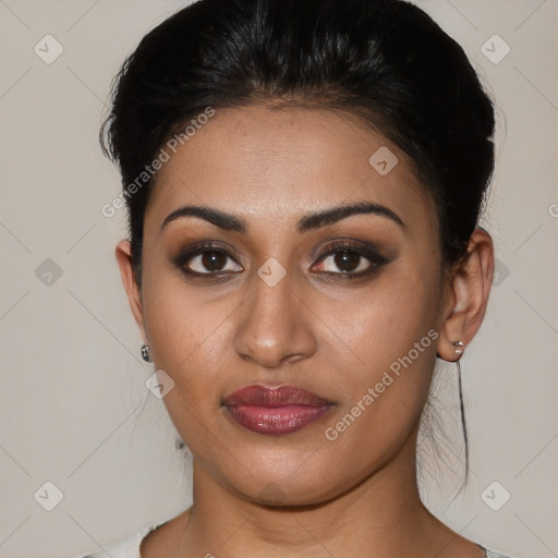 Joyful latino young-adult female with short  brown hair and brown eyes