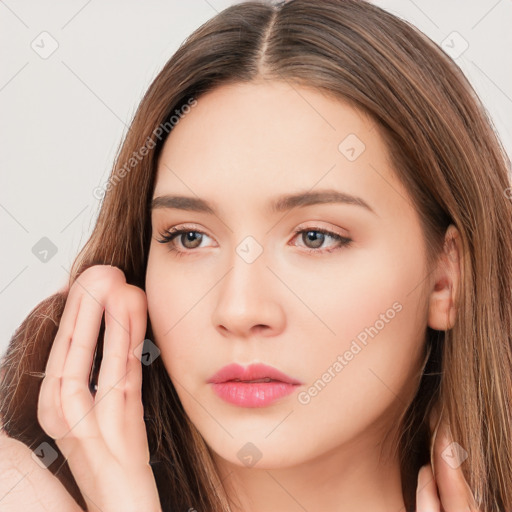 Neutral white young-adult female with long  brown hair and brown eyes