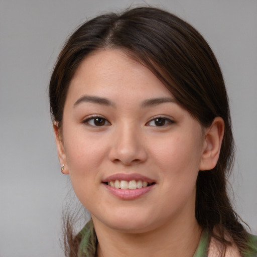 Joyful white young-adult female with medium  brown hair and brown eyes