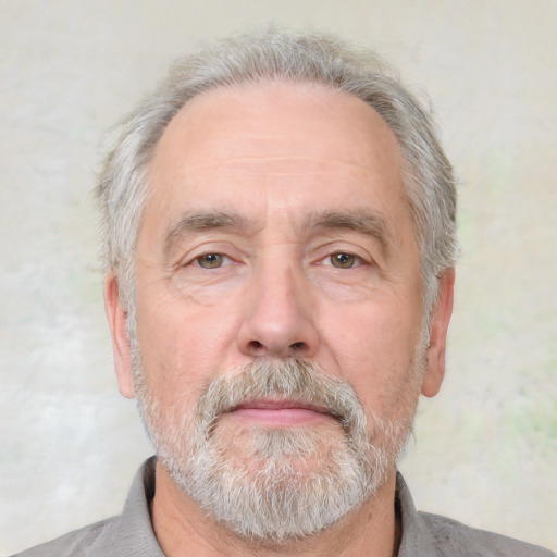 Neutral white middle-aged male with short  gray hair and brown eyes