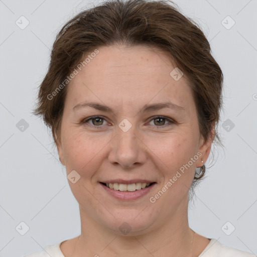 Joyful white adult female with short  brown hair and brown eyes