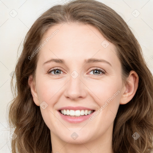 Joyful white young-adult female with long  brown hair and green eyes