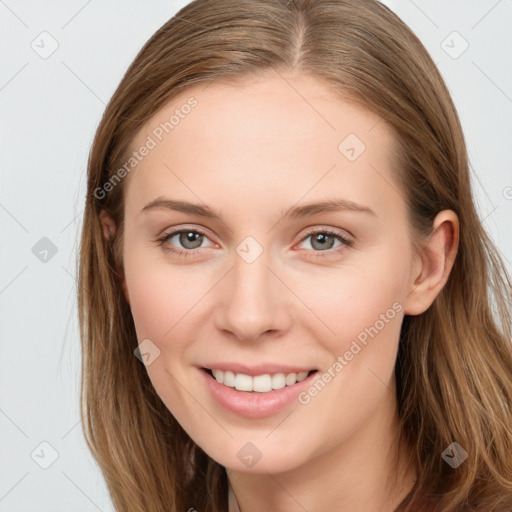 Joyful white young-adult female with long  brown hair and blue eyes