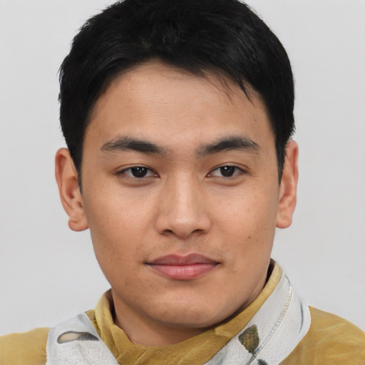 Joyful asian young-adult male with short  brown hair and brown eyes