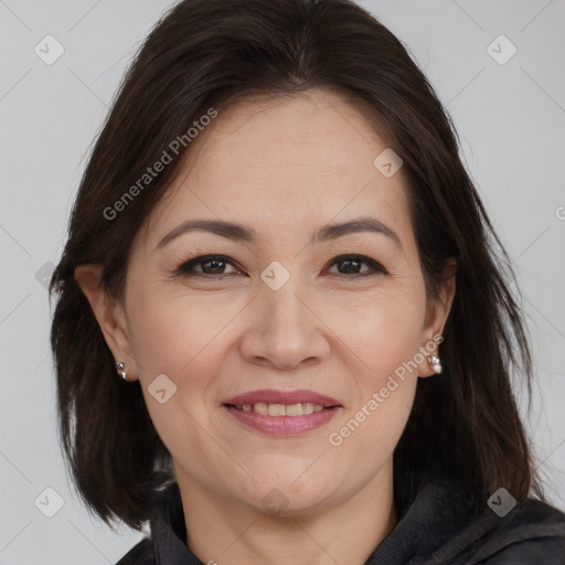 Joyful white adult female with medium  brown hair and brown eyes