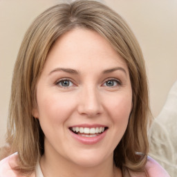 Joyful white young-adult female with medium  brown hair and green eyes