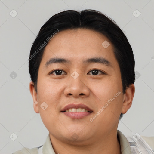Joyful asian young-adult male with short  black hair and brown eyes
