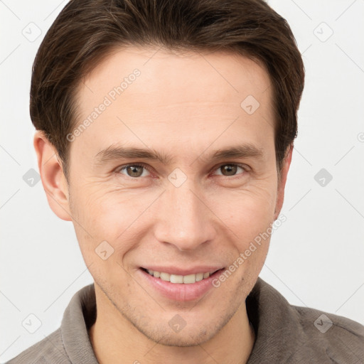 Joyful white young-adult male with short  brown hair and grey eyes