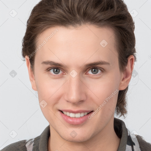 Joyful white young-adult female with short  brown hair and grey eyes